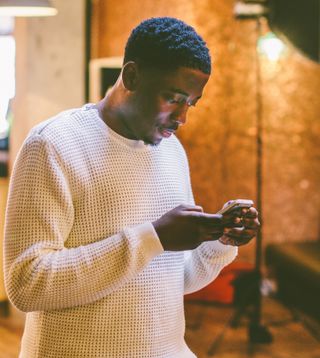 Man looking down at his phone